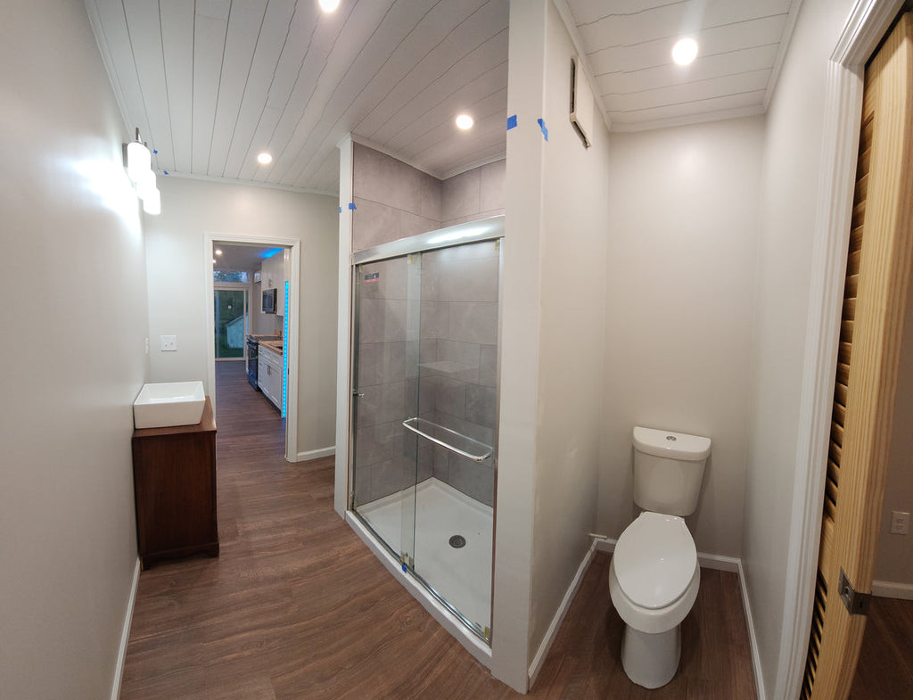 Full bathroom with a glass shower enclosure and vessel sink